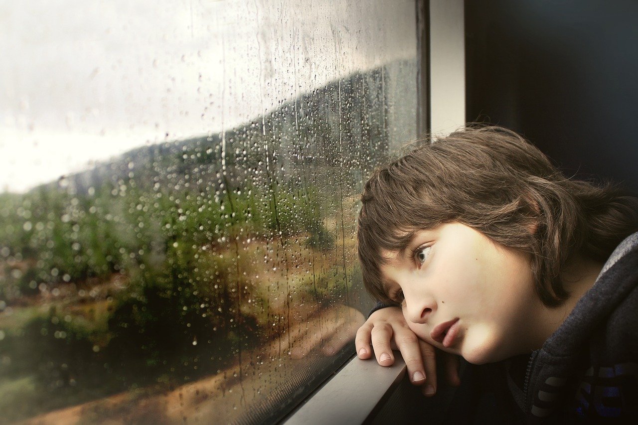 Sad boy in rain.