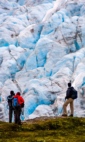 People in front of an icy mountain